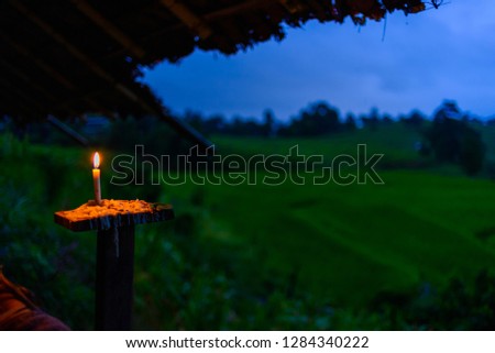 candle light in bamboo hut on rice farm