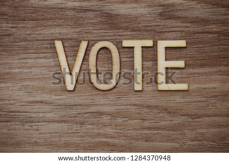 Vote Alphabet Letters on wooden background