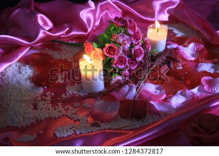 Roses bouquet and candle burning photoshoot. Valentine day
