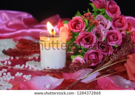 Roses bouquet and candle burning photoshoot. Valentine day