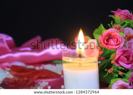 Candle burning with bouquet for photoshoot Valentine day
