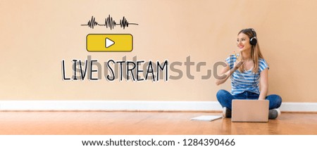 Live stream with young woman with headphones using a laptop computer and a pencil