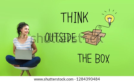Think outside the box with young woman using a laptop computer 