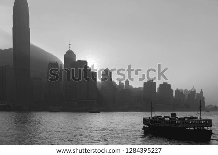 Silhouette of Hong Kong Victoria Harbour. During sunset; Black & White Color