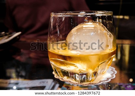 wishkey on the rock with ice ball Royalty-Free Stock Photo #1284397672