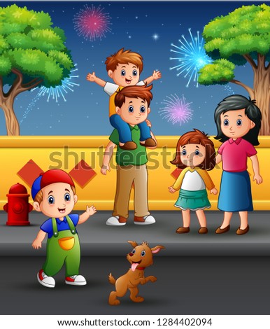 Happy family outdoors with a background of fireworks in the sky