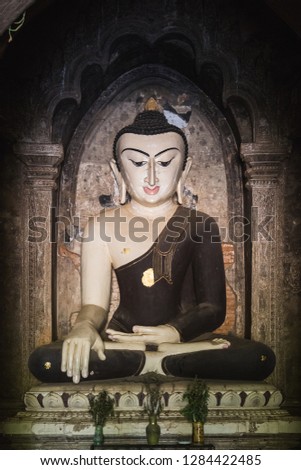 Giant buddha statue in temple in Bagan
