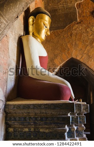 Giant buddha statue in temple in Bagan
