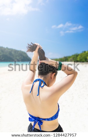 Young traveler girl at the beach in Phuket, Thailand. with copy space.
