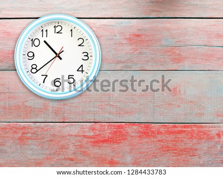 Wall clock (white-blue) on painted wooden walls. 
Looked simple.
