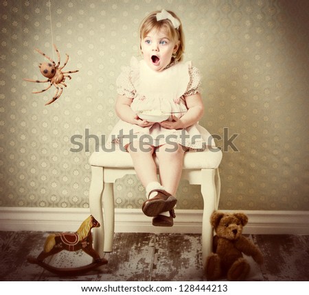 Little Miss Muffet shocked by spider Royalty-Free Stock Photo #128444213