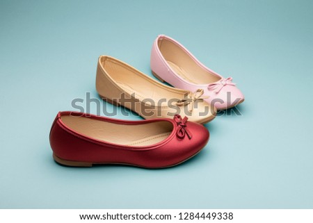 Flats shoes red, gold and pink on color background for shoes catalog, fashion spring summer