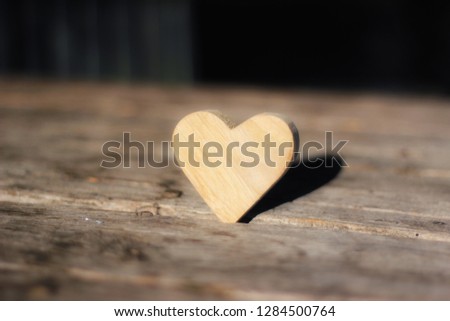 Valentines Day beckground with wooden hearts.