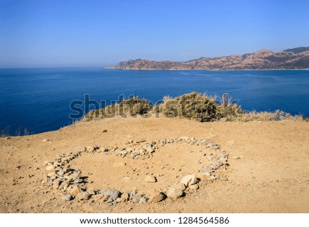 Heart shape stones on the shore of Corse