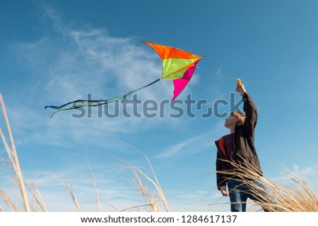Flying a kite. boy with a kite against the sky. Flight, sunny day. 