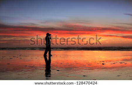Photographer capturing at wonderful sunset.