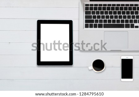 top view tablet computer notebook on background wood