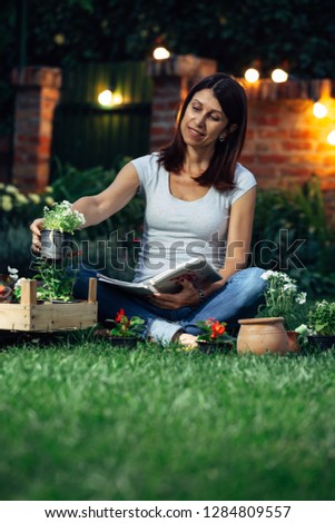 woman choosing seedlings for her garden