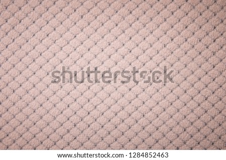 Textured background surface of textile upholstery furniture close-up. burlap beige color fabric structure