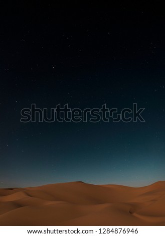 Starry night in liwa desert among the dunes in the night