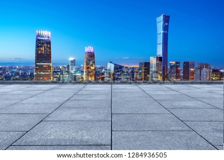 Marble platform and modern urban night view, Beijing, China.
