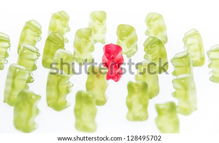 Red Bear in the middle of a group green Gummi Bears