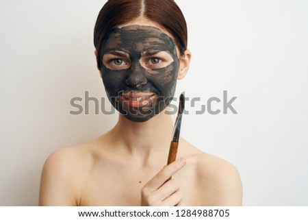 young woman smiling on face cosmetic mask clay skin care