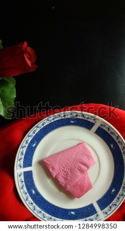 It’s a picture for event valentine day. The picture contains lovely dinner elements plate, rose, heart. The image can be used for many purpose.