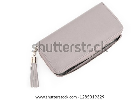 Pearl color open case. Woman light pink/ purple /gray wallet isolated on the white background. Closeup of modern light pink leather wallet/ bag over white background. Top view on the purse.
