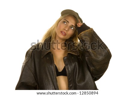 Beautiful blond model wearing black bra under leather jacket and hand on brim of baseball cap