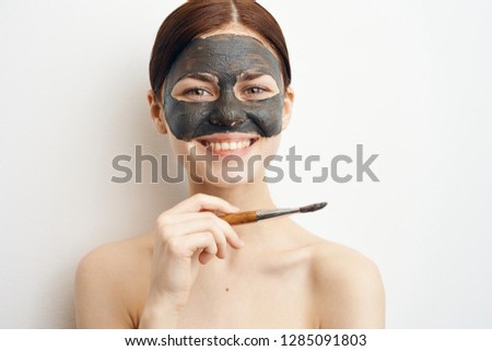 woman smiling on face clay mask care