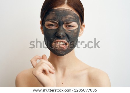 woman bit her lip facial cosmetic mask