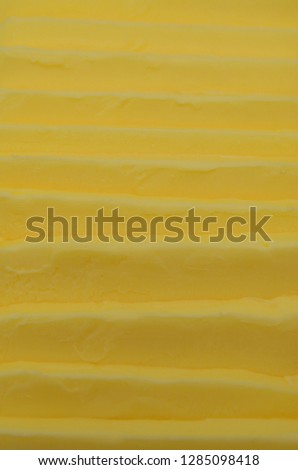 Slices of butter as a background. Butter is used for baking and frying and it adds a delicious flavour. Great picture for food advertisements