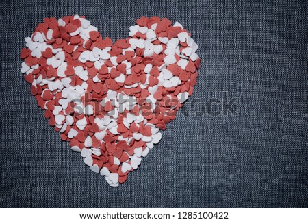 Small cute hearts arranged in the shape of a heart. Valentine's concept