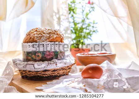 Kulich-Paska, painted eggs,  cottage cheese in the morning on the table by the window. life style festive background