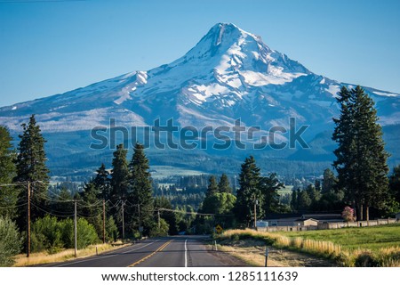 The road through Mt. Hood's Fruit Loop with Mt. Hood mountain looming in the background in Oregon