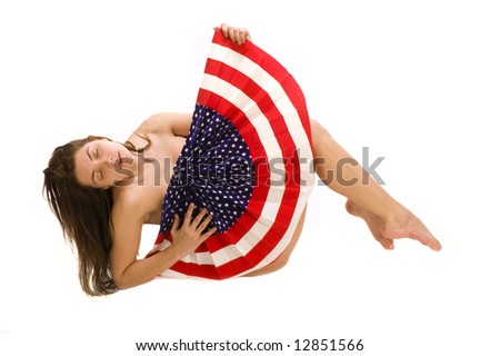 Attractive female American patriot with flag isolated over white