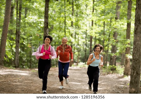 Middle aged women walking in forest