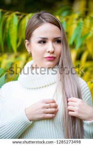beautiful blonde girl in forest