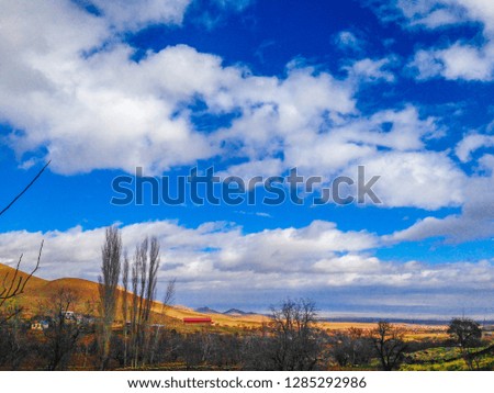 a beautiful mountains in a cloudy day under blue sky in the autumn 