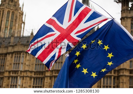 European Union and British Union Jack flag flying together. A symbol of the Brexit EU referendum Royalty-Free Stock Photo #1285308130
