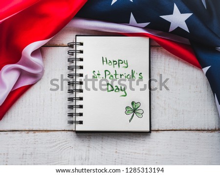 St.Patrick's Day. Beautiful card. Notepad with congratulatory inscription. Isolated background, close-up, annnnnnCongratulations for loved ones, relatives, friends and colleagues 