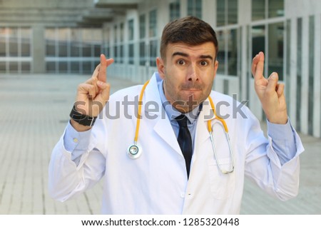 Untruthful healthcare worker crossing fingers 