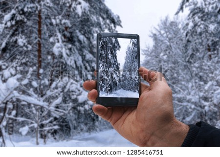 photo shooting on smartphone during a winter walk