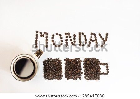 Roasted Coffee Beans background texture isolated on white background with copy space for text. Monday writing top view, battery and a mug