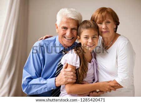 Portrait of a businessman, with his wife and daughter.