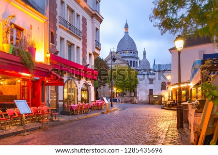 The Place du Tertre with tables of cafe and the Sacre-Coeur in the morning, quarter Montmartre in Paris, France Royalty-Free Stock Photo #1285435696