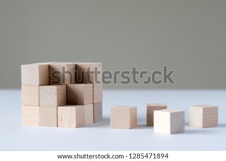 Wood cubes to complete a bigger square block