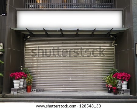 blank billboard on the wall of a closed store