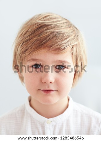 shoulder portrait of cute, nine years old kid, boy for id card